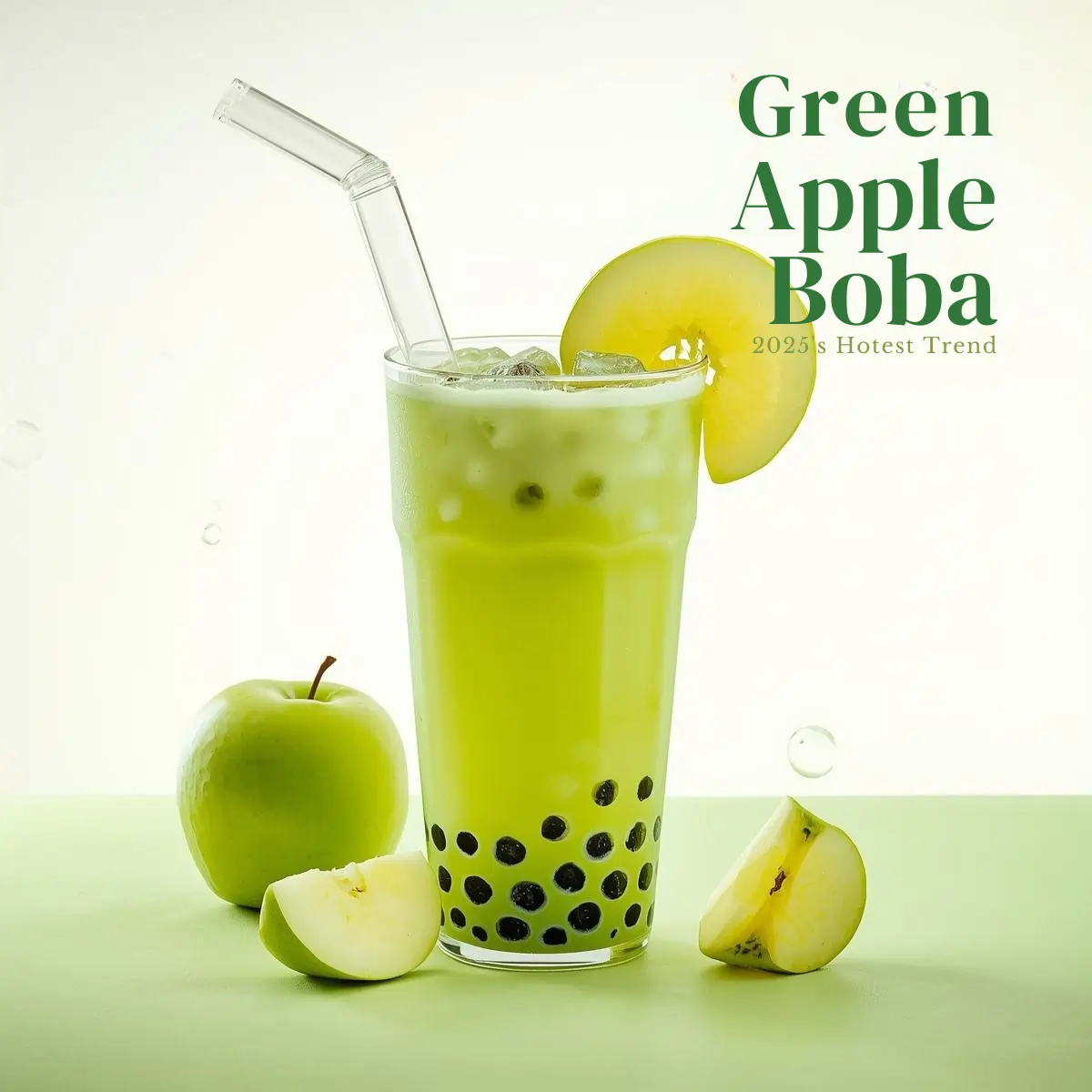 Tall glass of vibrant green apple bubble tea containing dark tapioca pearls at bottom, garnished with fresh apple slice and clear wide straw